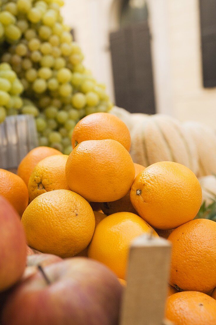 Oranges, apples and grapes at a market