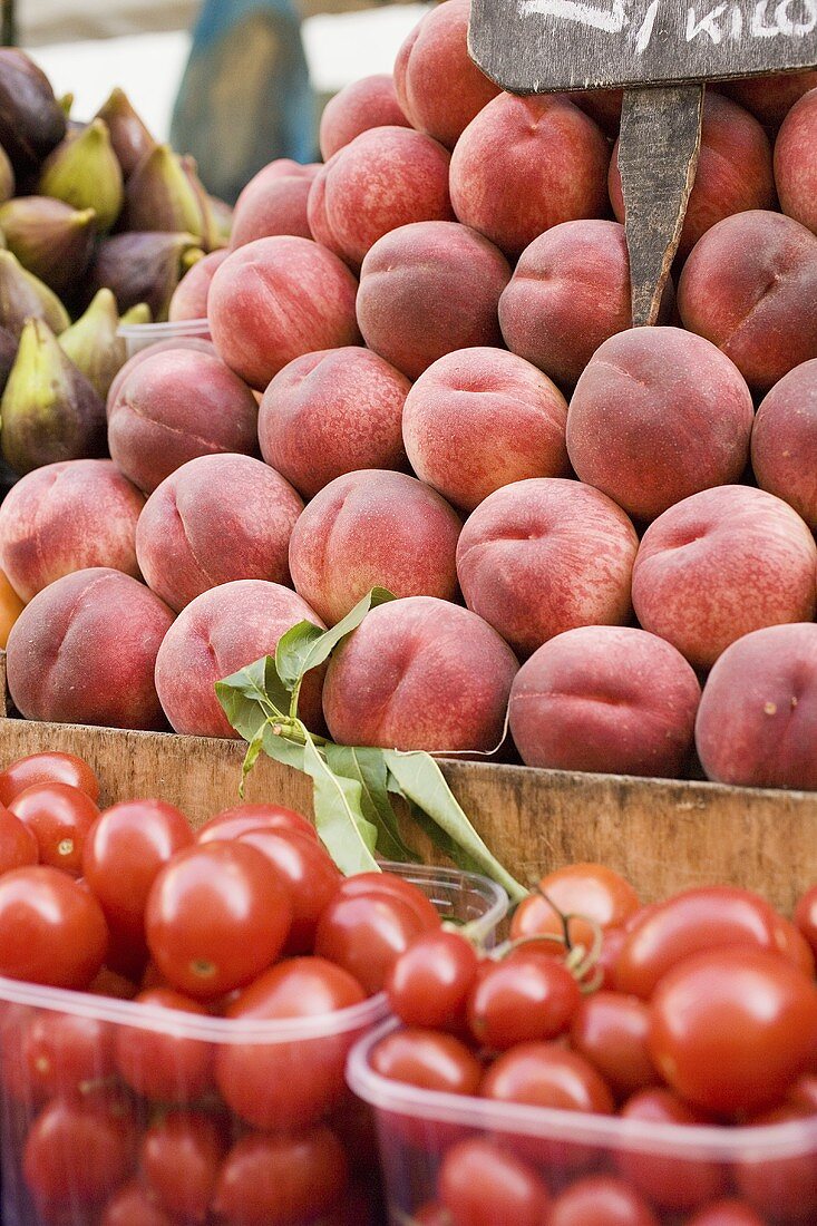 Tomatoes and peaches at a market