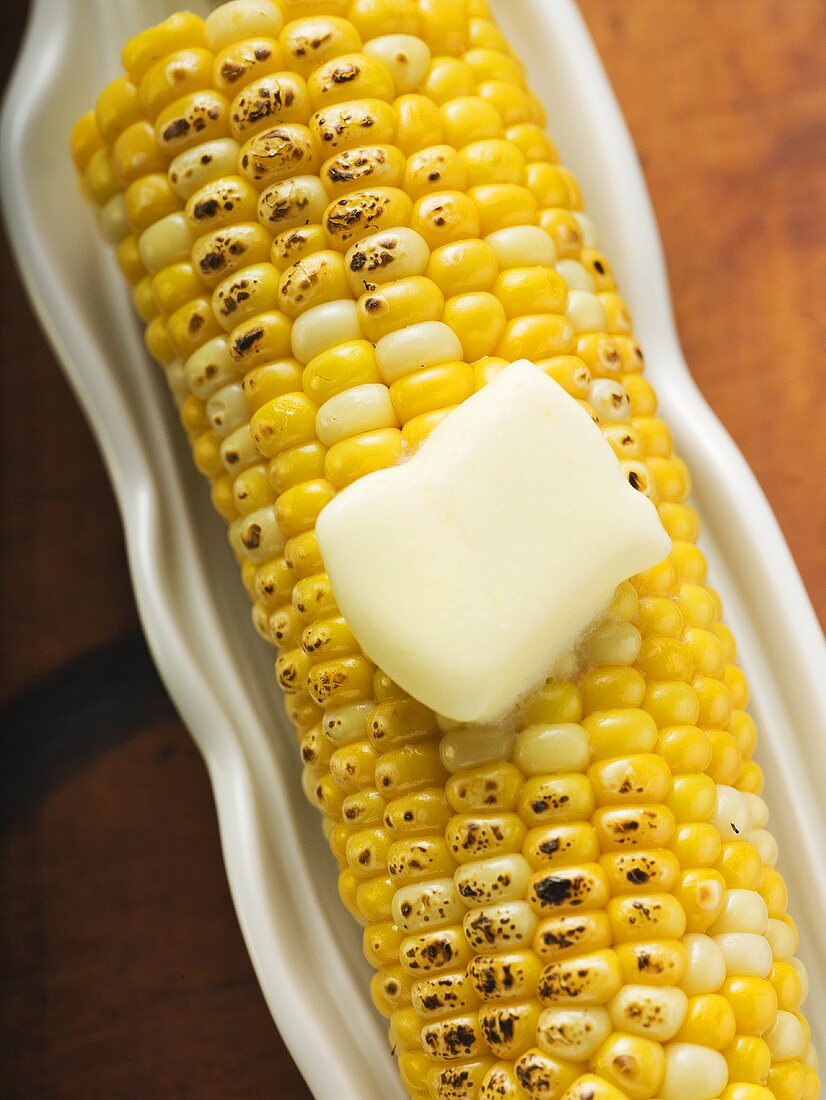 Grilled corn cob with knob of melting butter