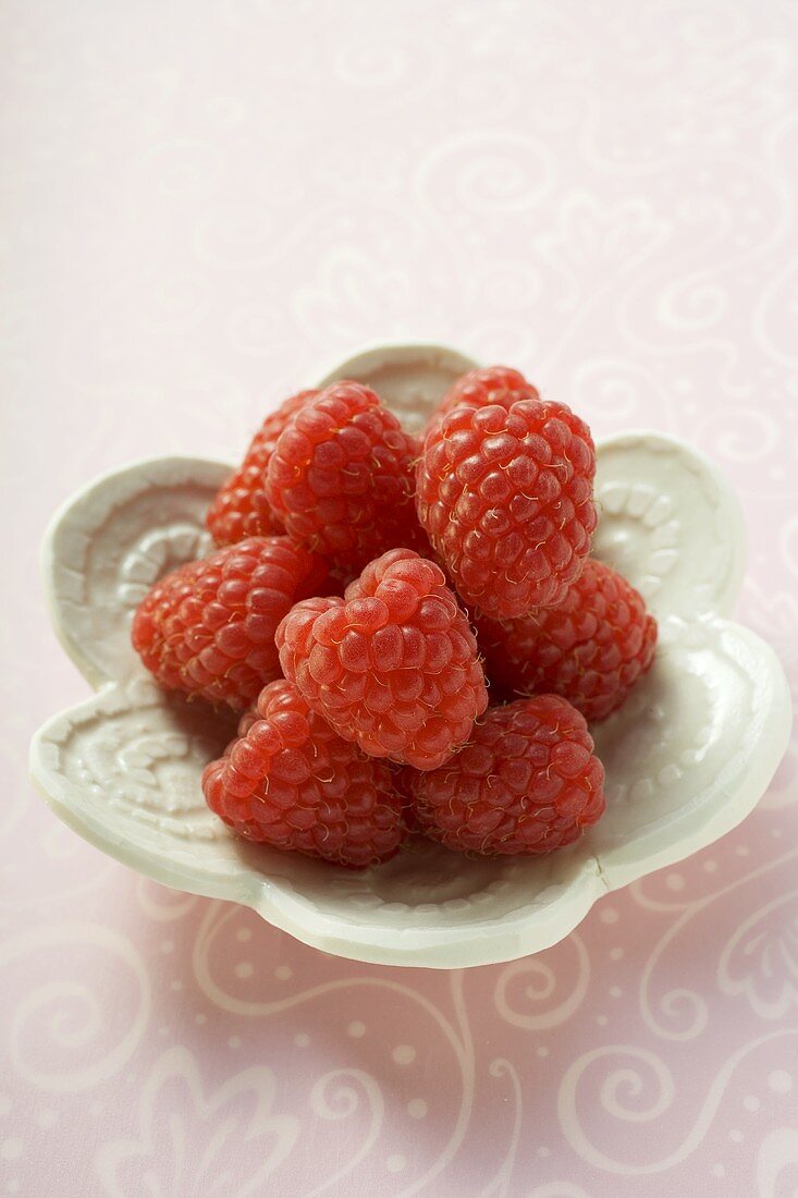 Raspberries in small white dish