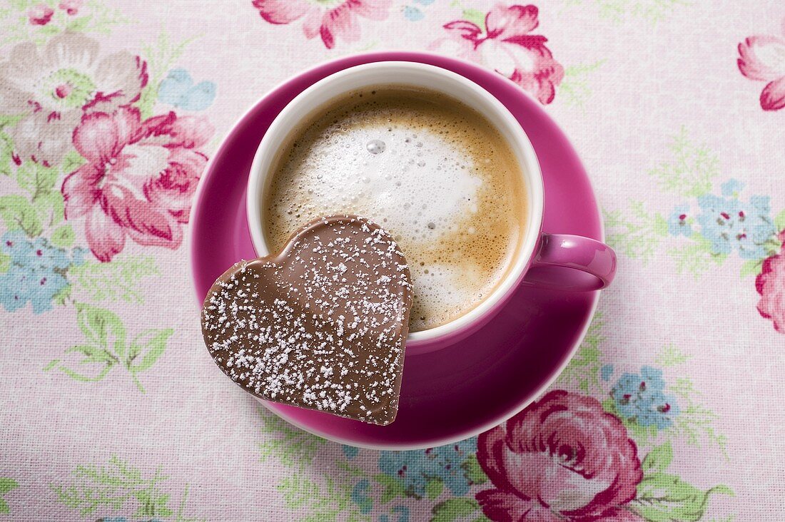 Cup of cappuccino with chocolate heart