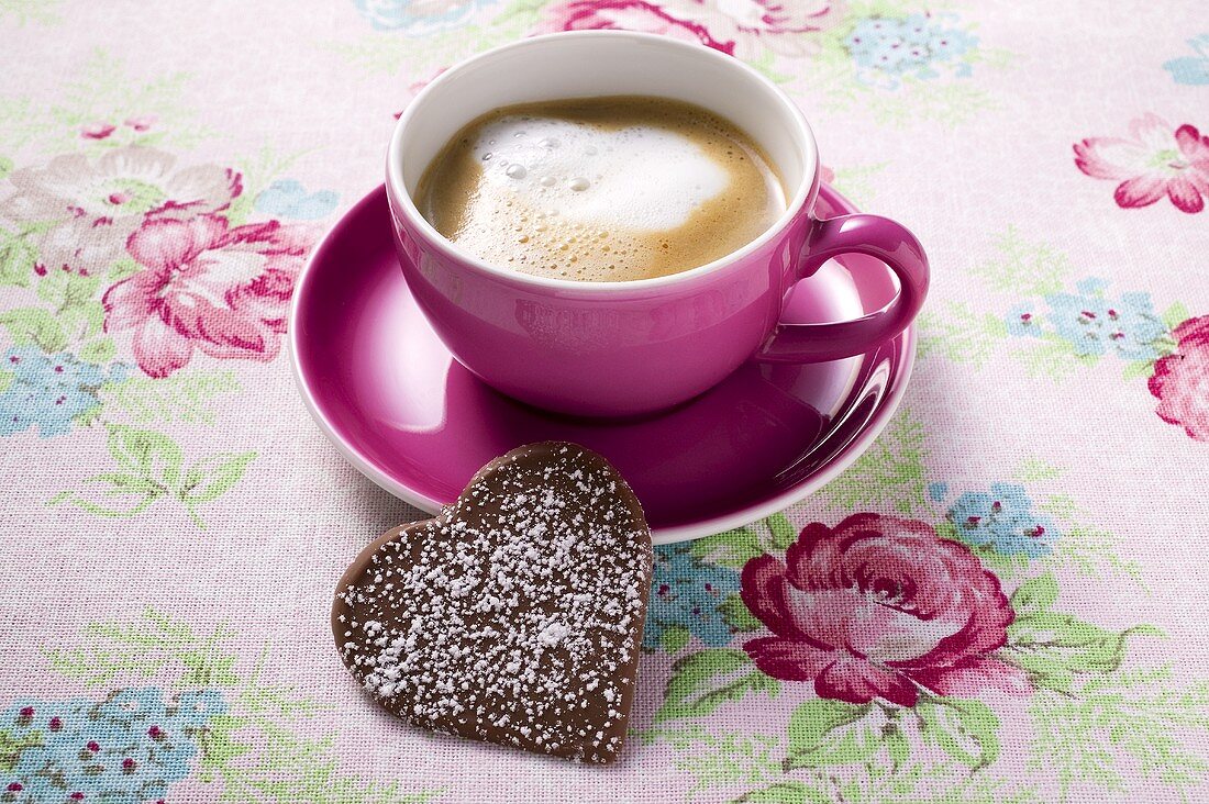 Cup of cappuccino with chocolate heart