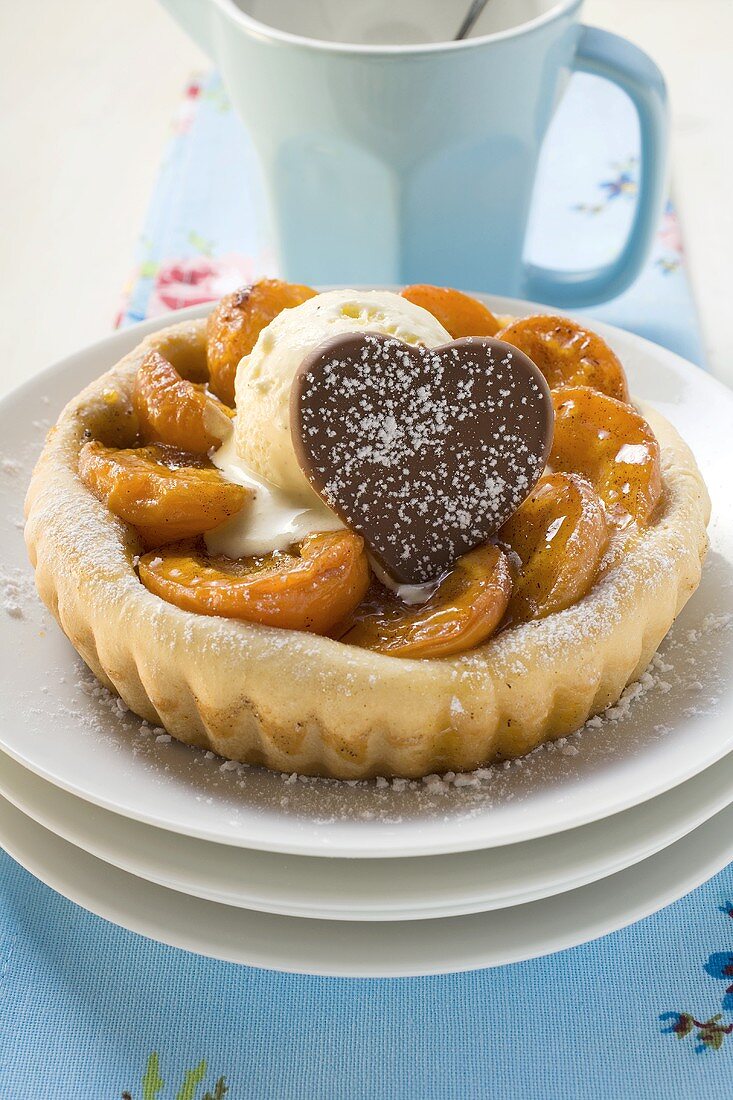 Apricot tart with vanilla ice cream and chocolate biscuit