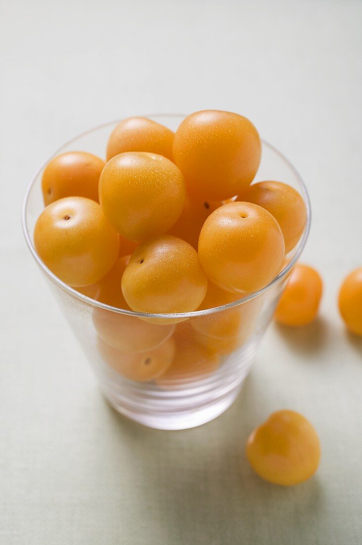 Mirabelles in and beside a glass