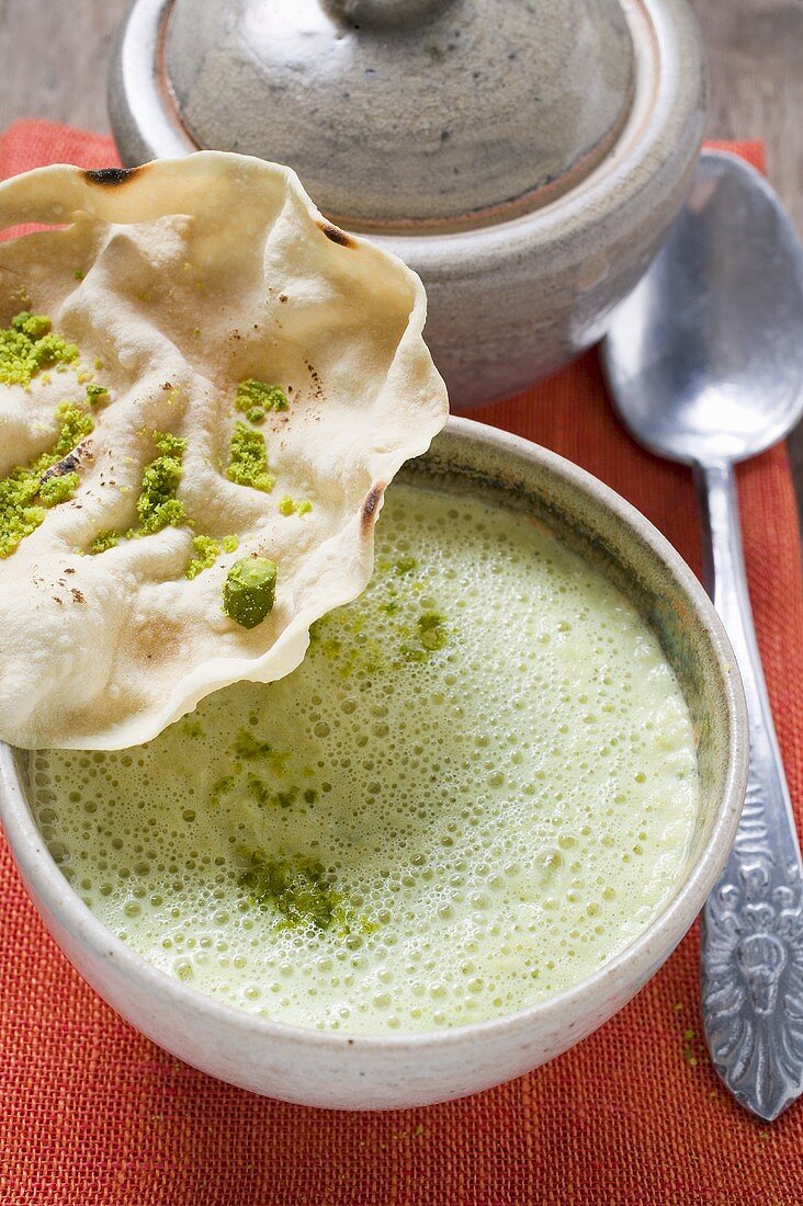 Curry soup with poppadam (India)