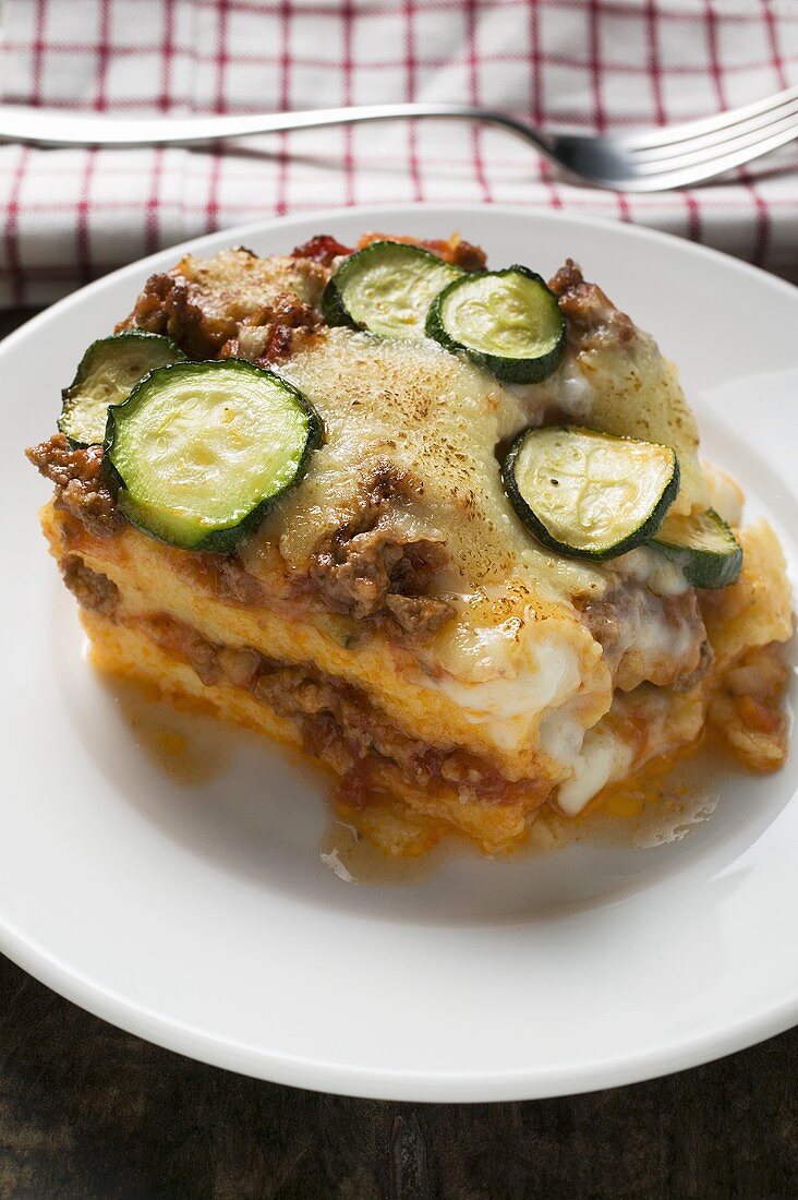Portion of polenta bake with mince and courgettes