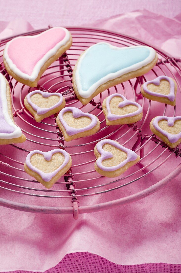 Assorted heart-shaped biscuits on cake rack