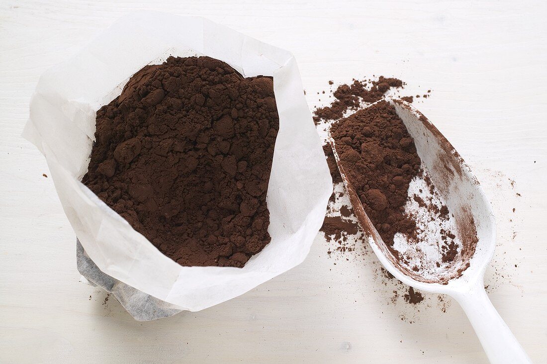 Cocoa powder in bag and scoop