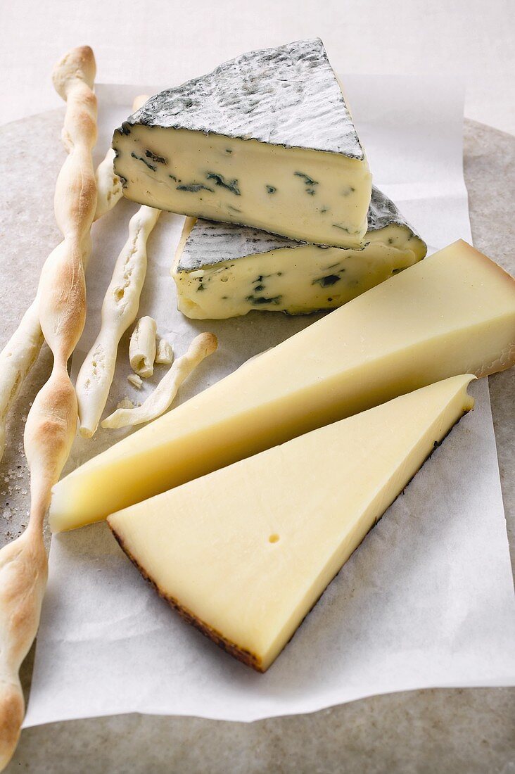 Various types of cheese and grissini