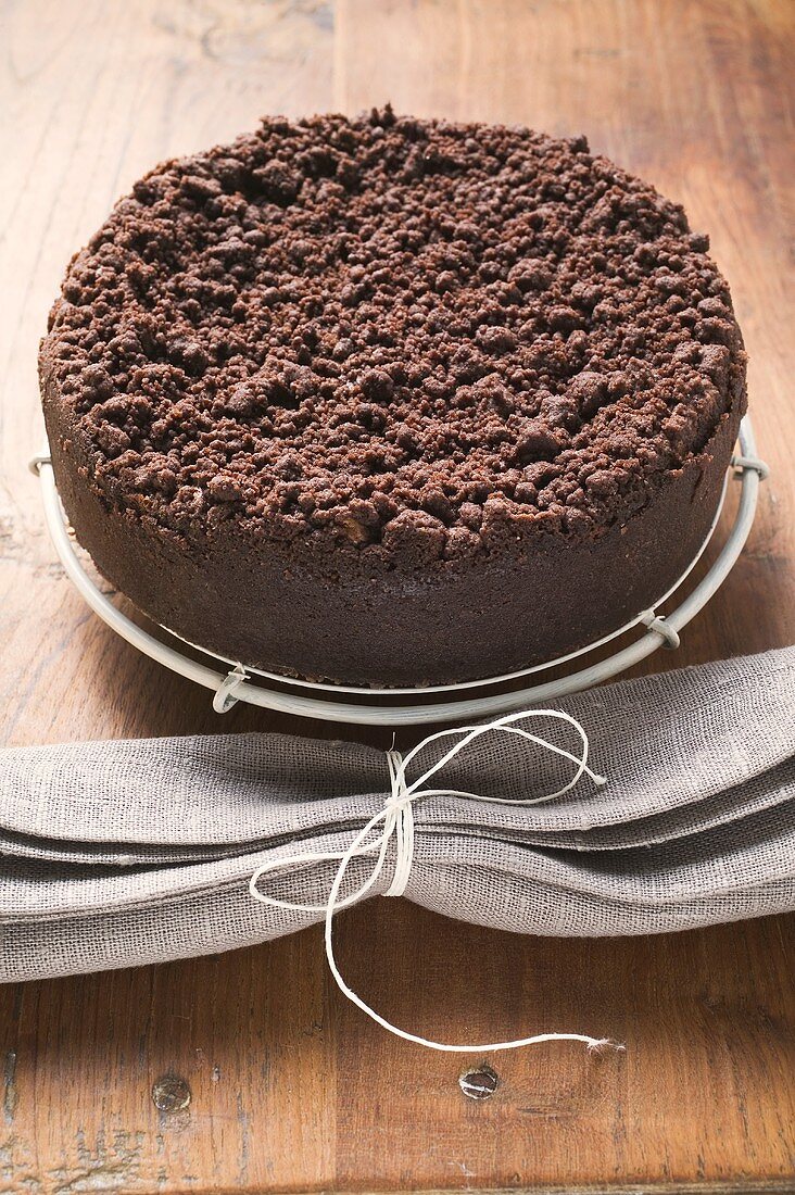 Chocolate crumble cheesecake on cake rack