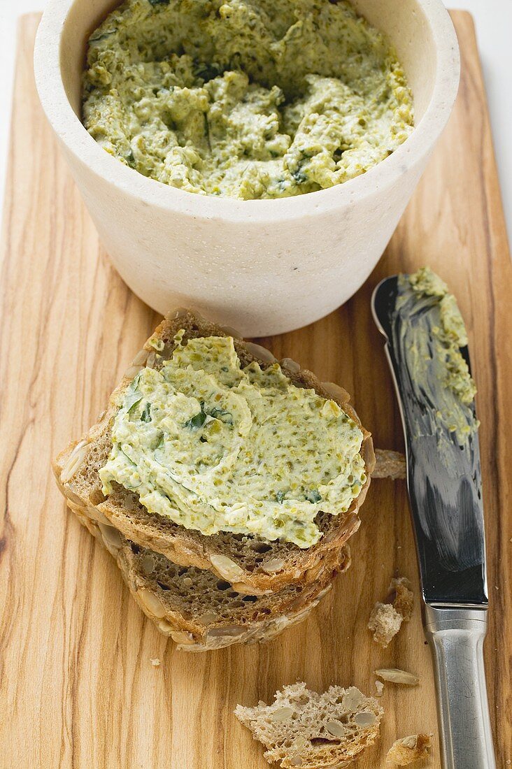 Corn salad cream with wholemeal bread and knife