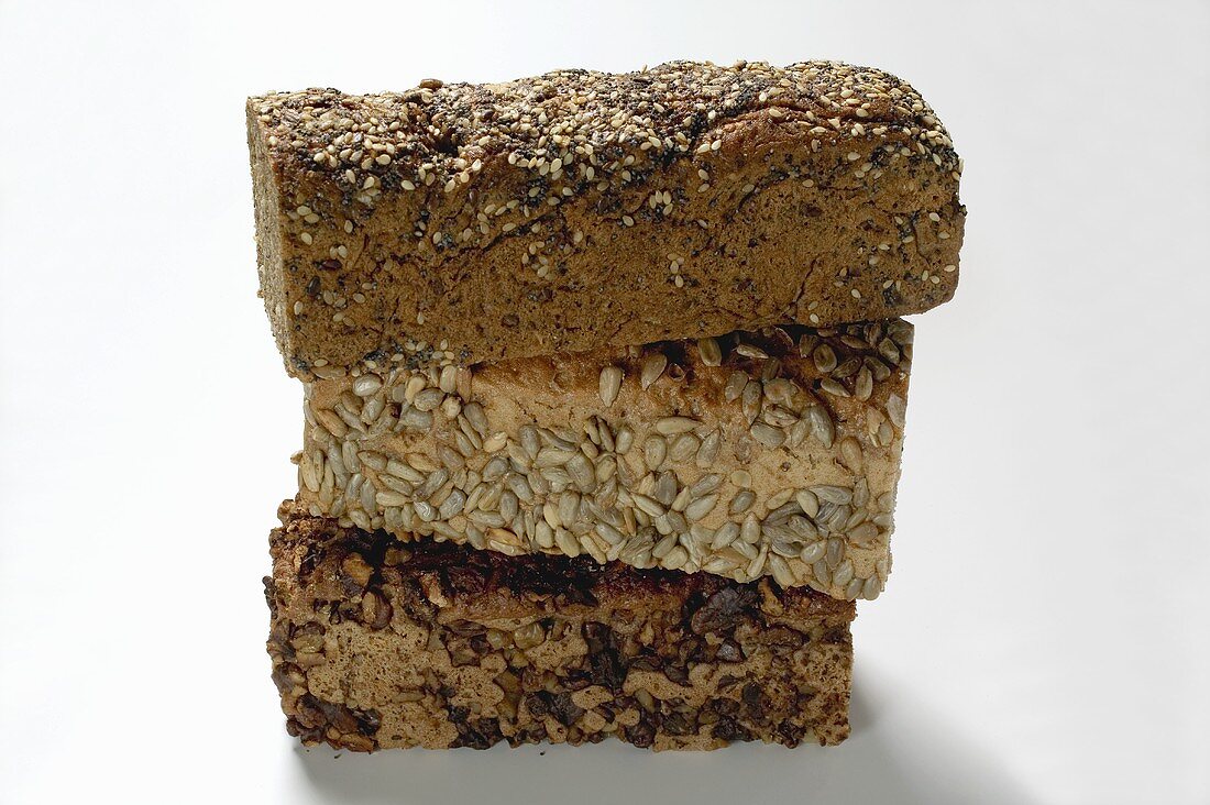 Three wholemeal loaves, in a pile