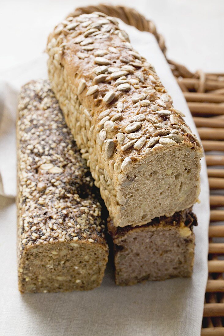 Three wholemeal loaves on tea towel