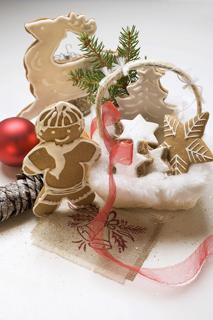 Gingerbread man, biscuits & cinnamon stars, partly in basket