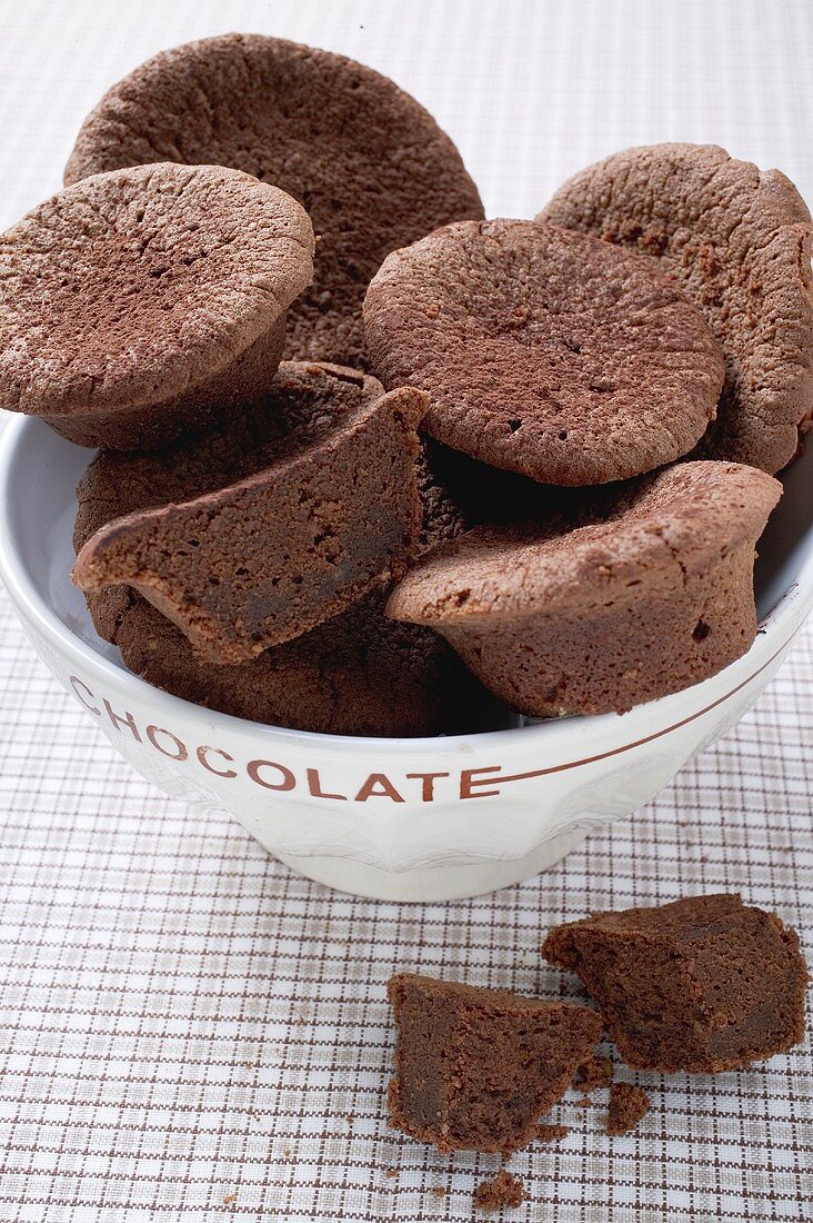 Several chocolate buns in white bowl