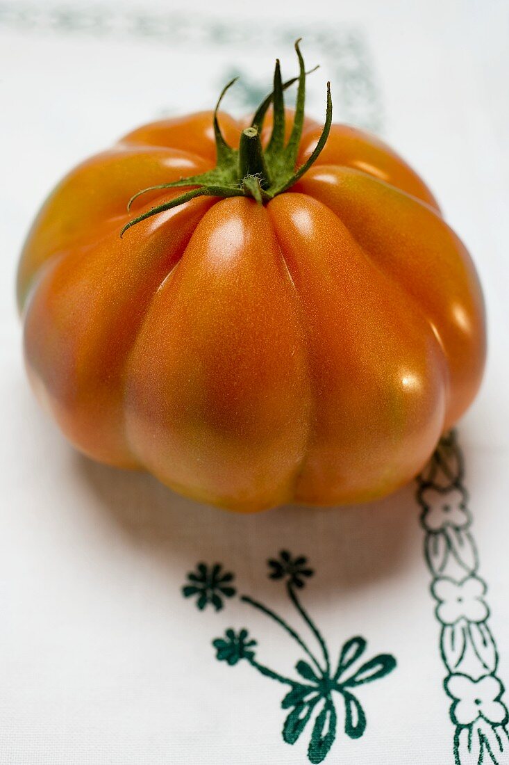 Tomato on tablecloth