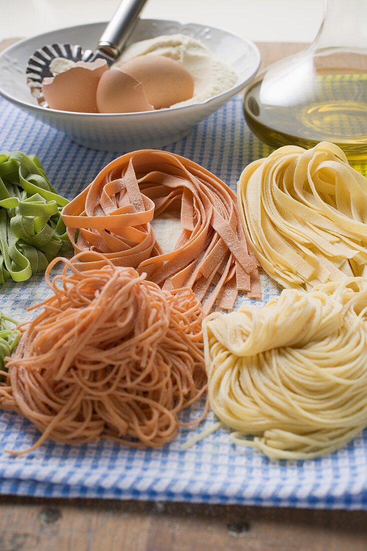 Various types of home-made pasta with ingredients