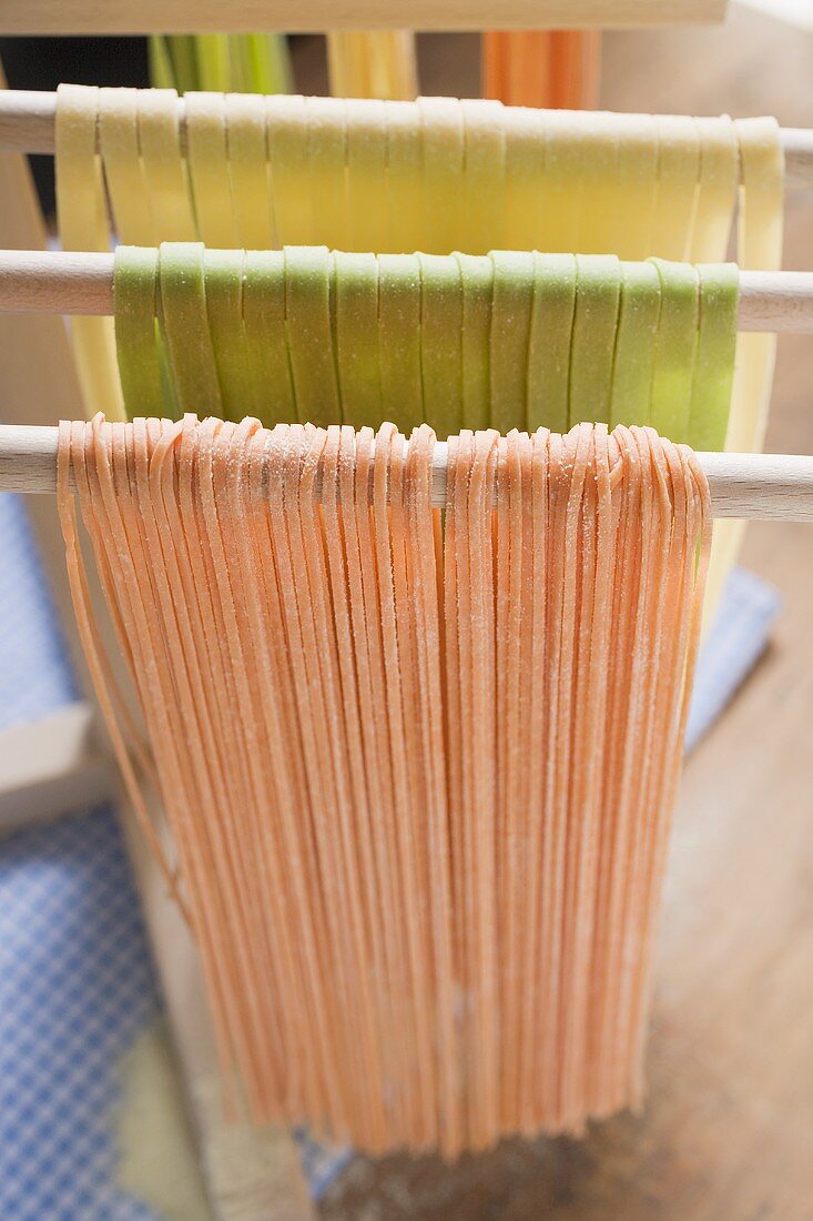 Home-made pasta, hanging up to dry