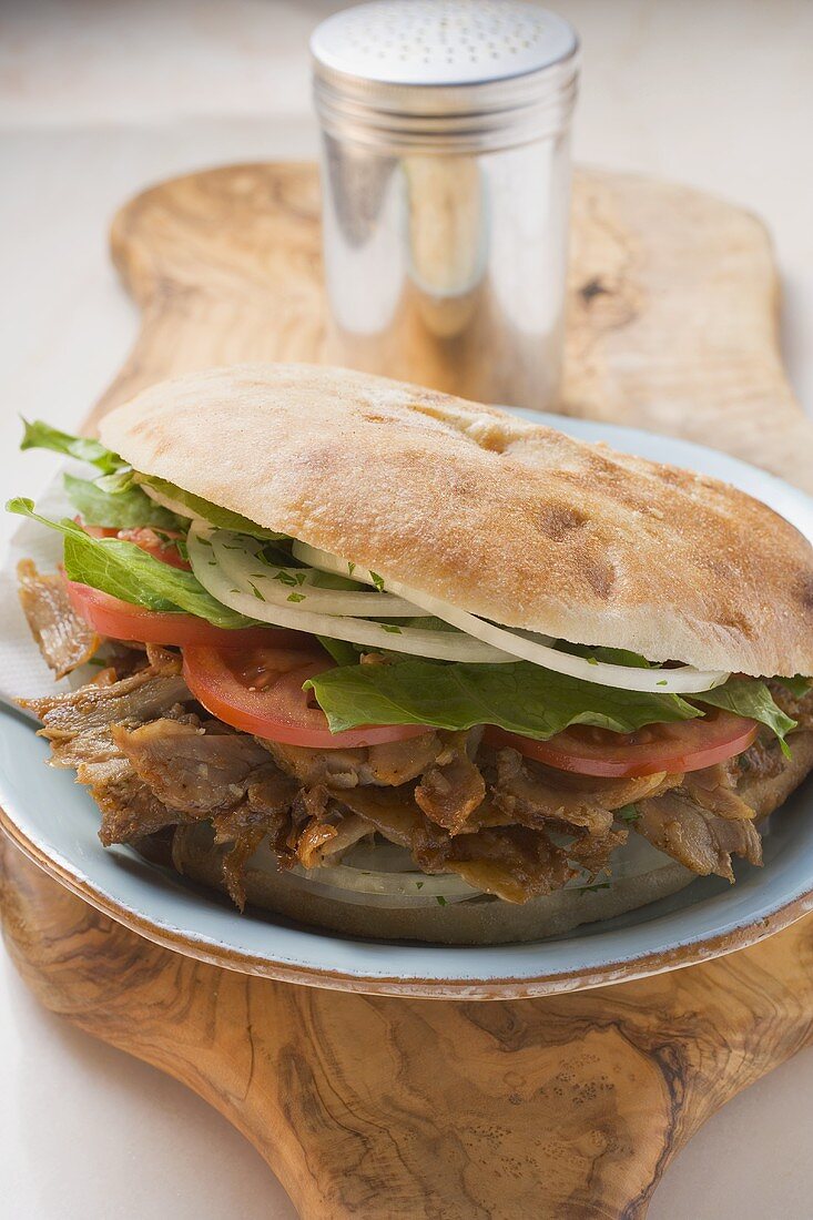 Döner kebab on chopping board