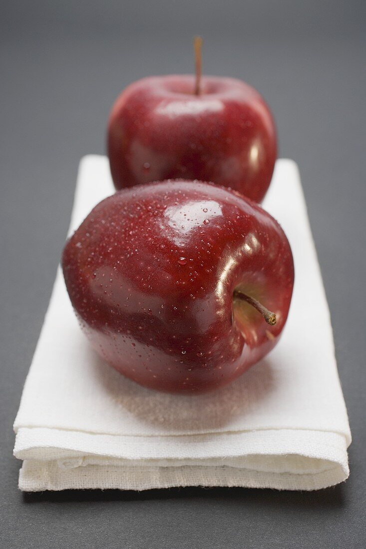 Two red apples, variety Stark, on linen cloth