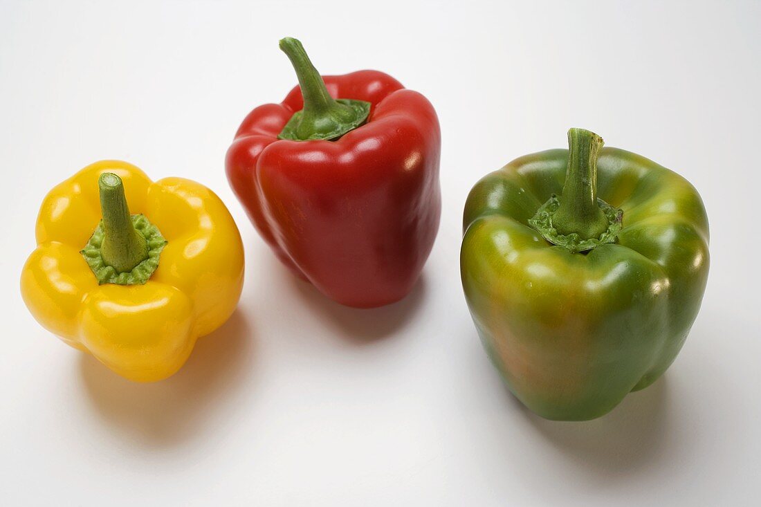 Three peppers (yellow, red, green)