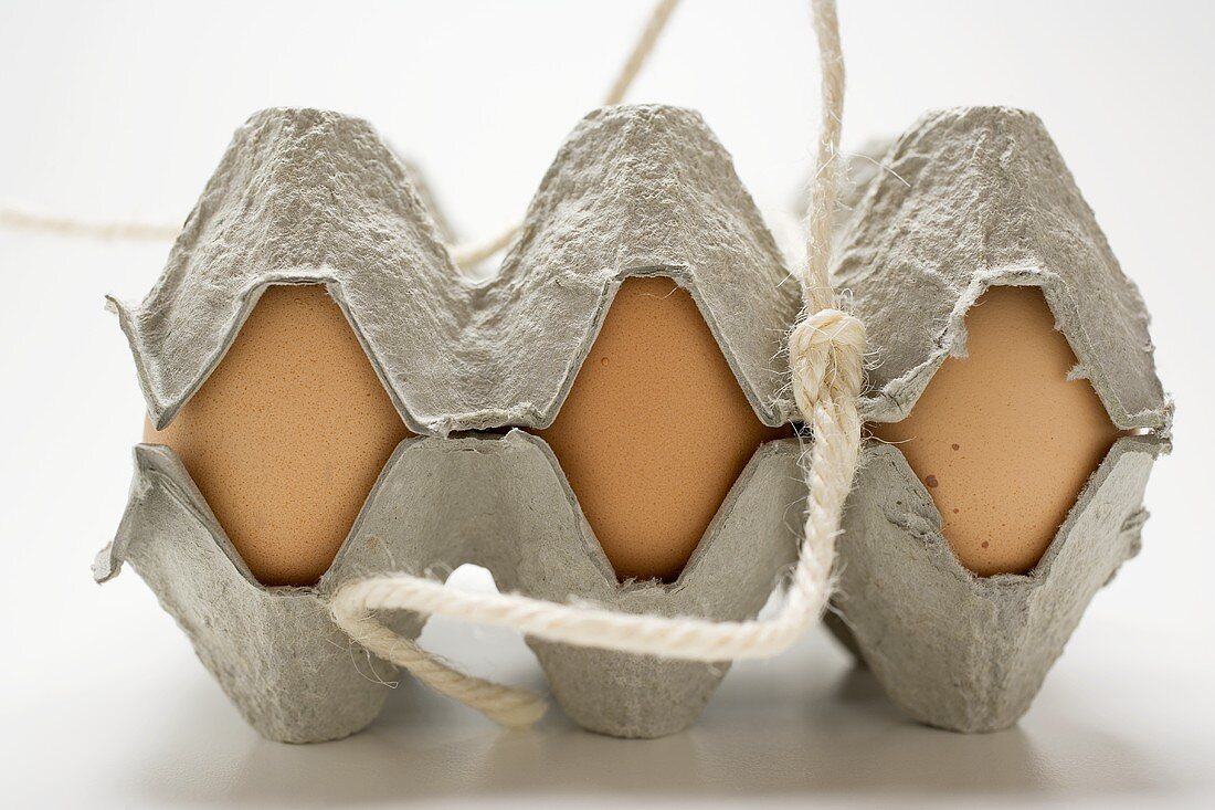 Brown eggs in an egg box