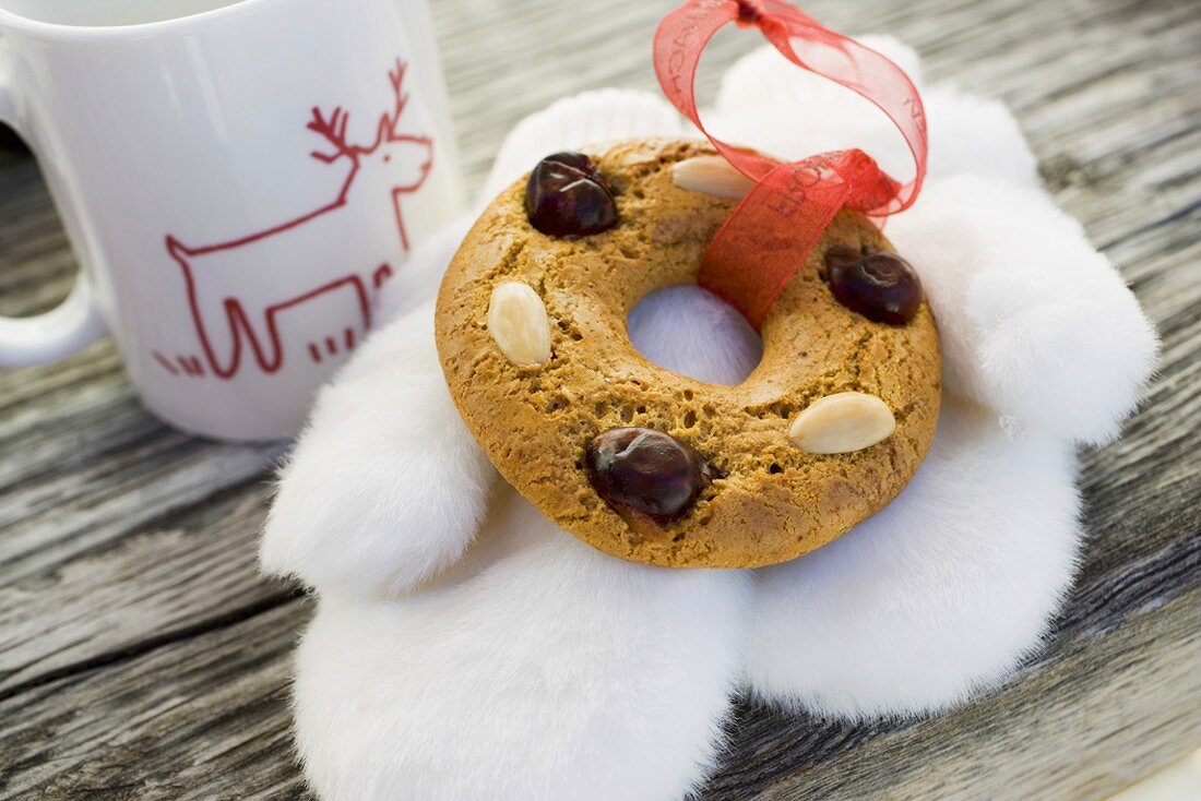 Gingerbread tree ornament, fur mittens and cup