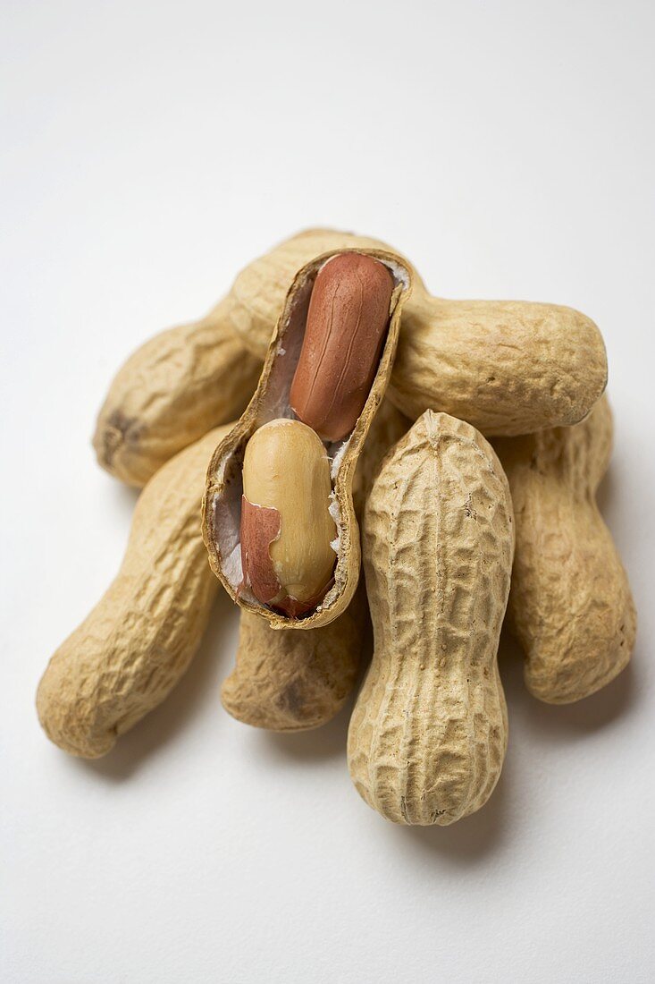 Several peanuts, one opened