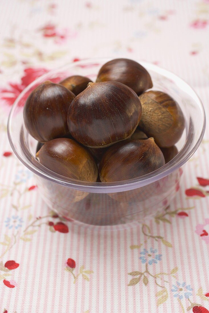 Several chestnuts in glass dish