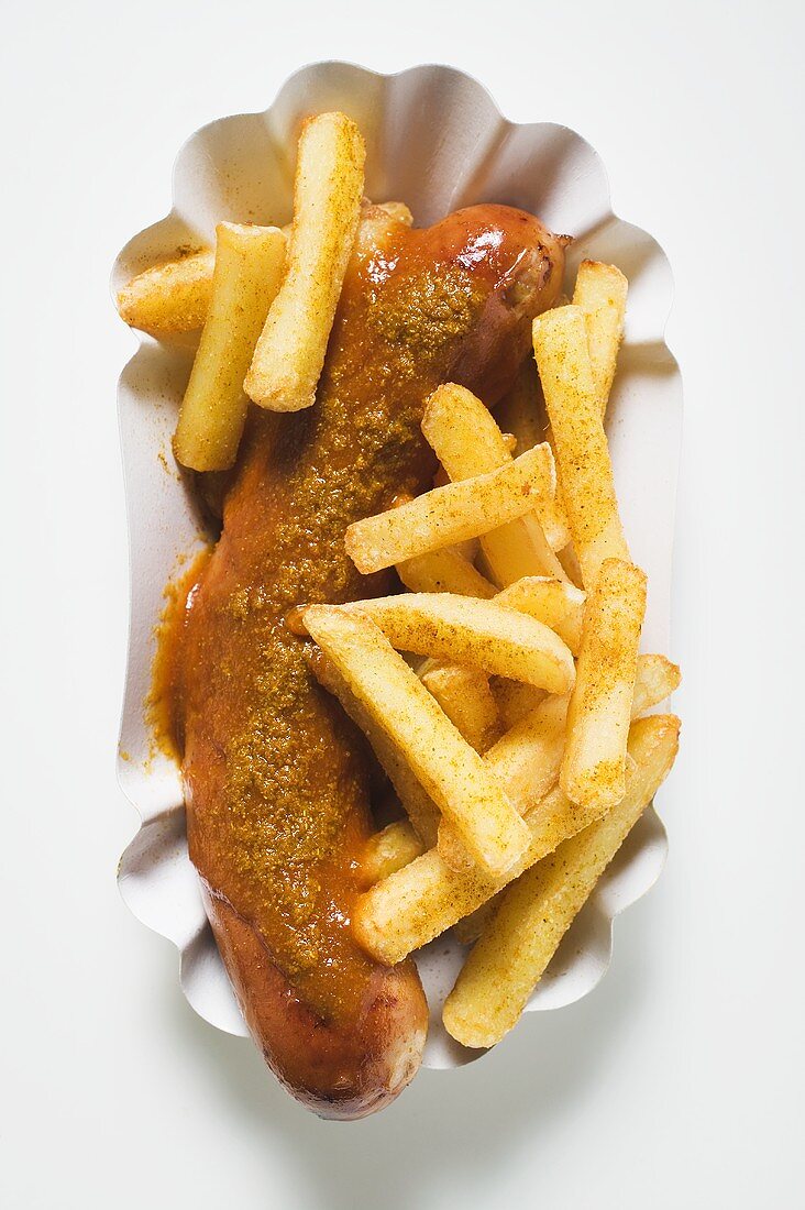 Currywurst (sausage with ketchup & curry powder) & chips in paper dish