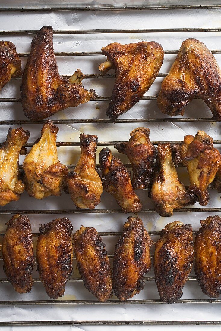 Grilled chicken wings on rack