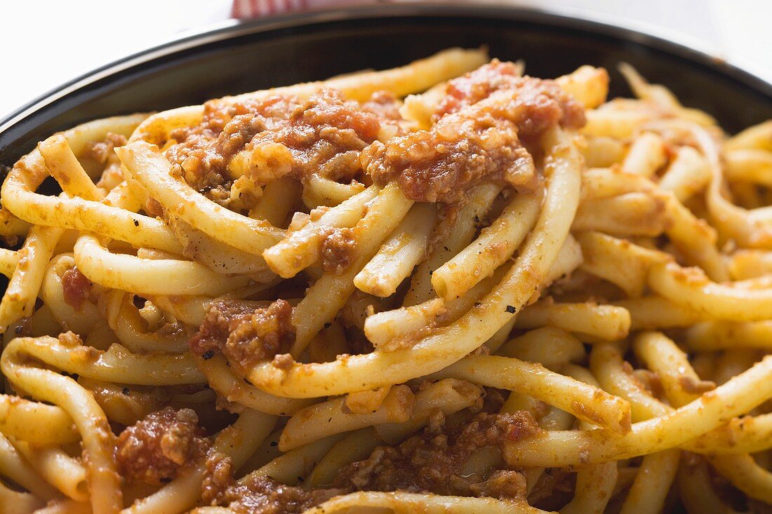 Macaroni with mince sauce in pan (close-up)