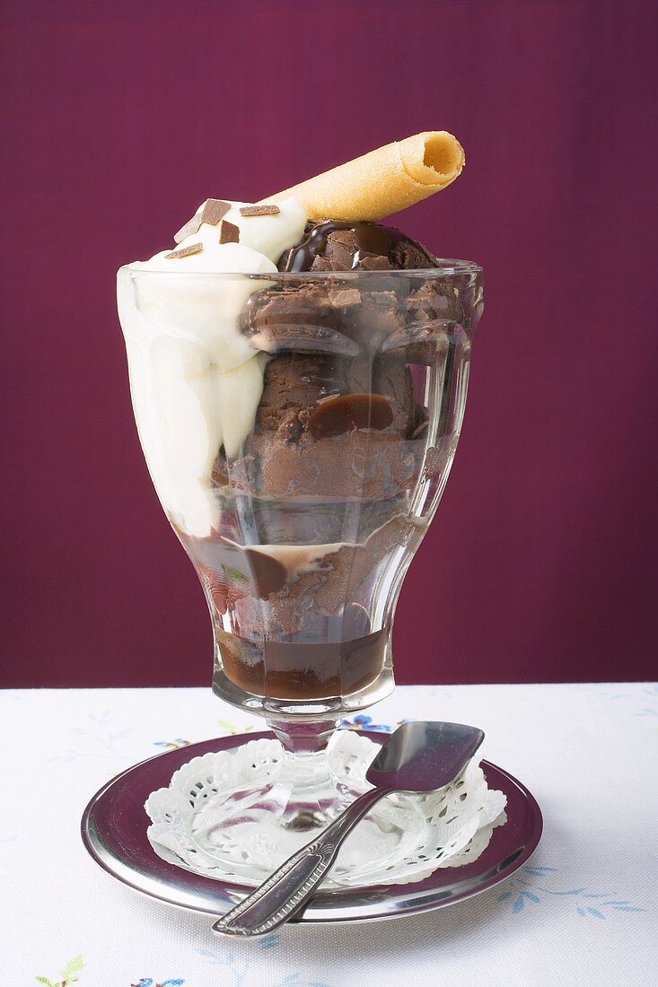 Sundae of chocolate ice cream, cream & wafer curl