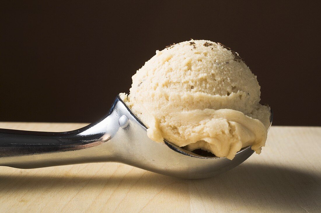 Scoop of ice cream in ice cream scoop