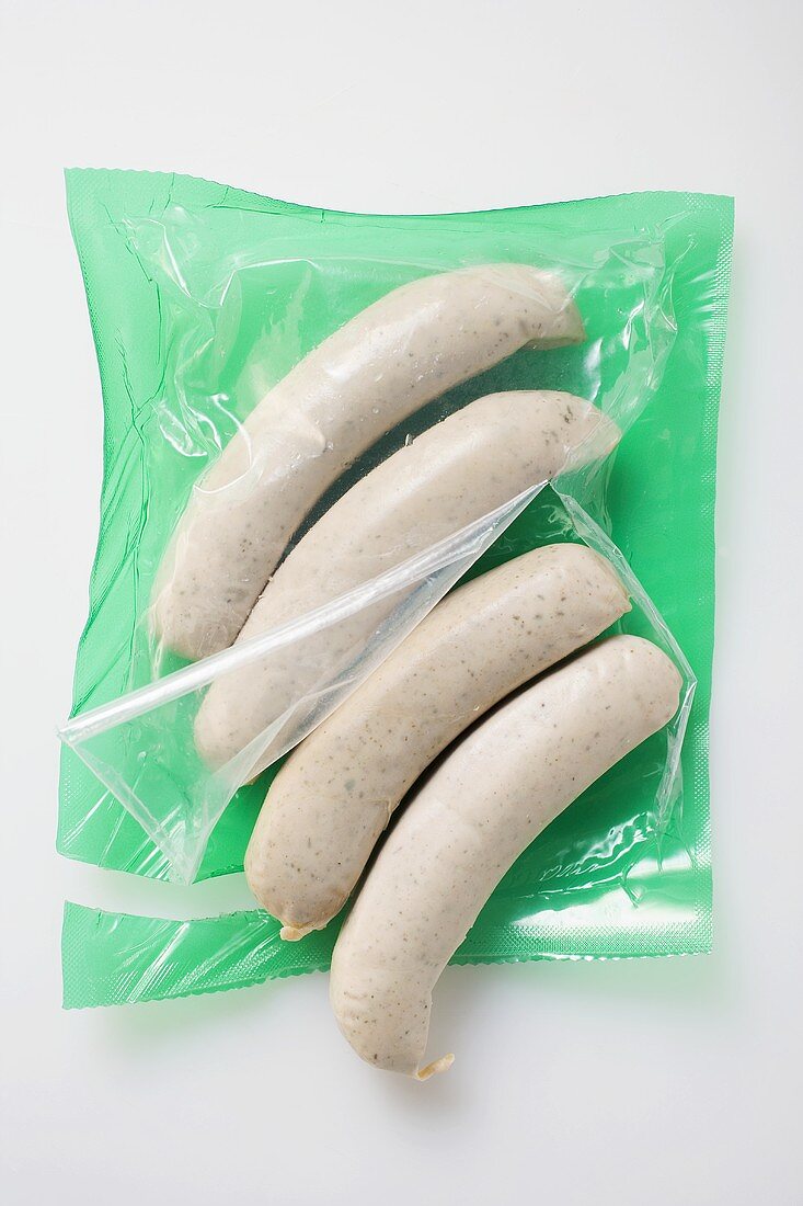 Fresh sausages in opened packaging