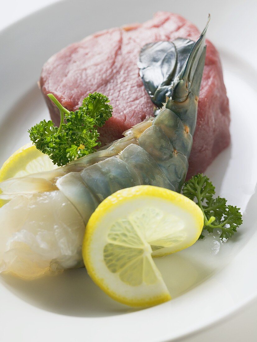 Ingredients for Surf and Turf: king prawn and beef steak