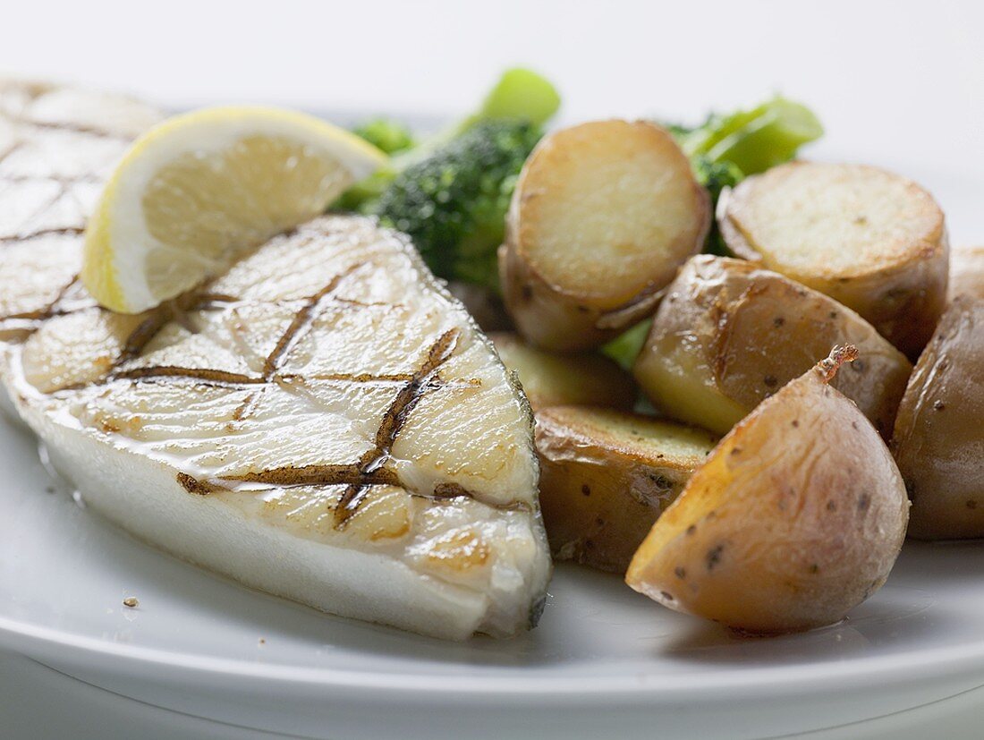 Grilled cod steak with potatoes