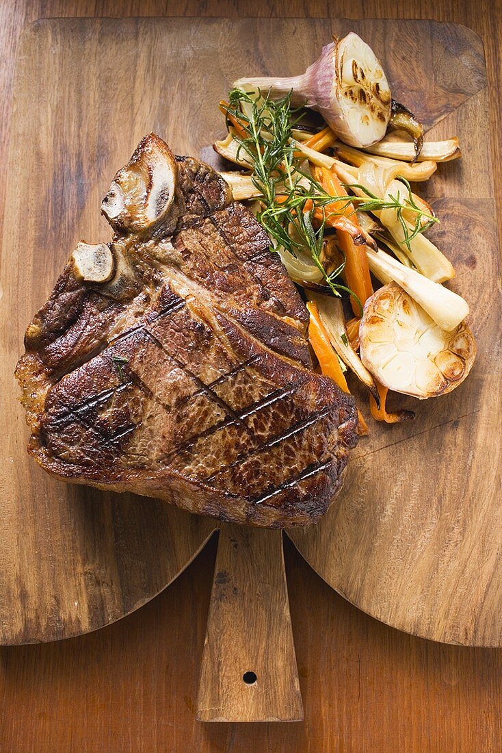 Grilled T-bone steak with vegetables
