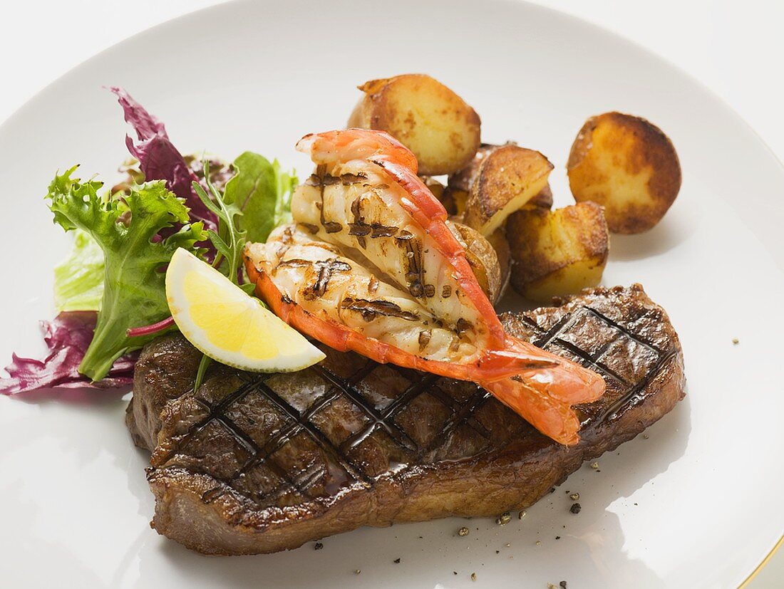 Surf and Turk (prawn and beef steak) with roast potatoes