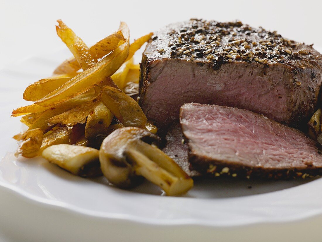 Peppered steak with chips and mushrooms