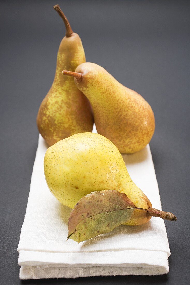 Three pears on cloth