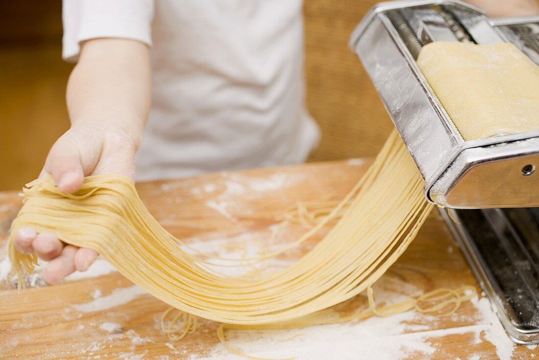 Making home-made linguine with pasta maker
