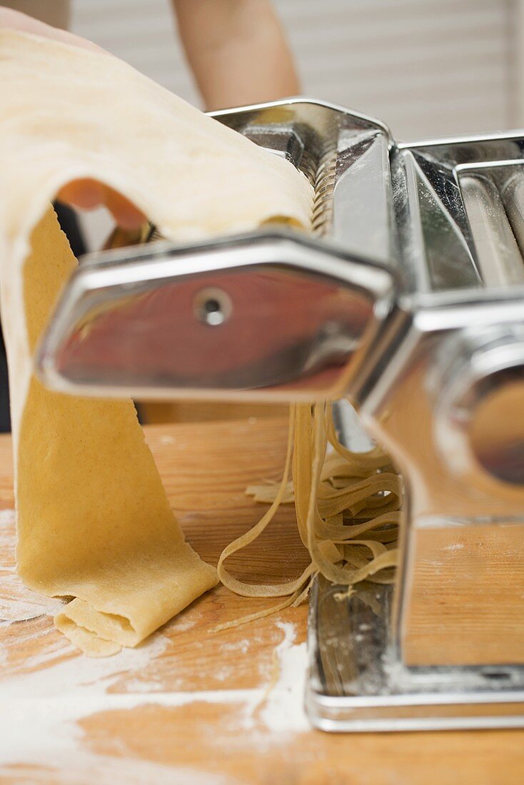 Making home-made ribbon pasta with pasta maker