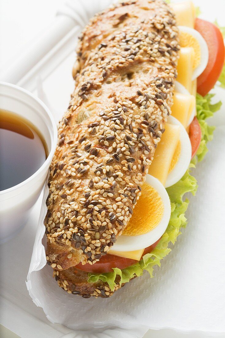 Granary roll filled with egg, cheese, tomato and lettuce