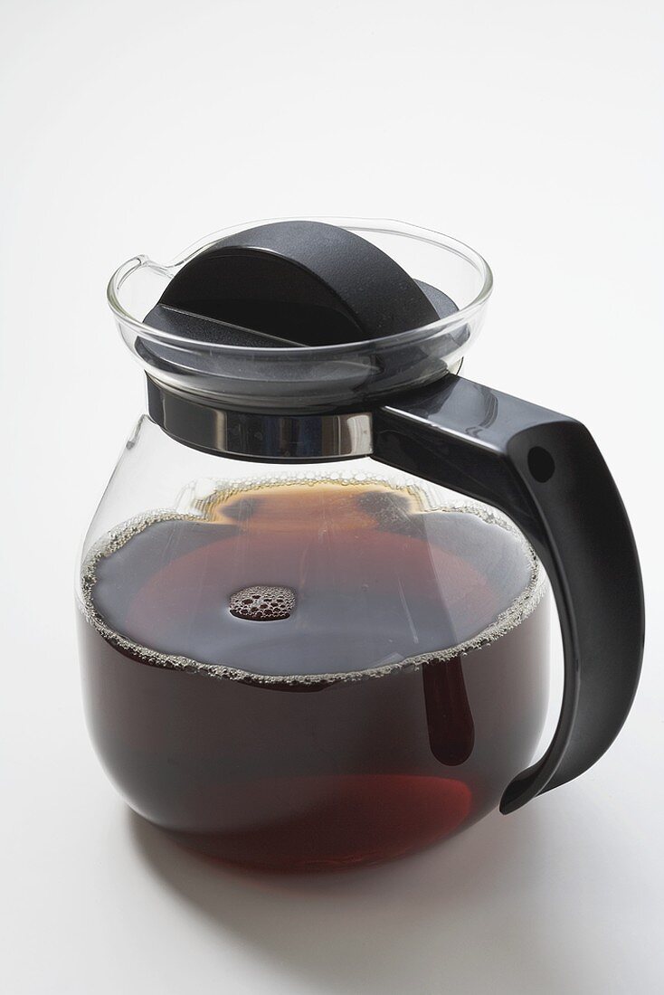 Black coffee in glass jug