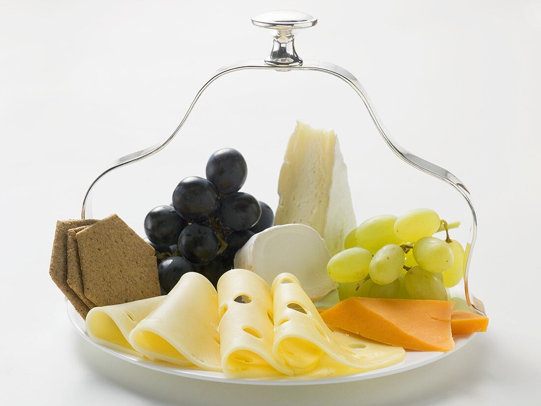 Cheese platter with grapes and crackers