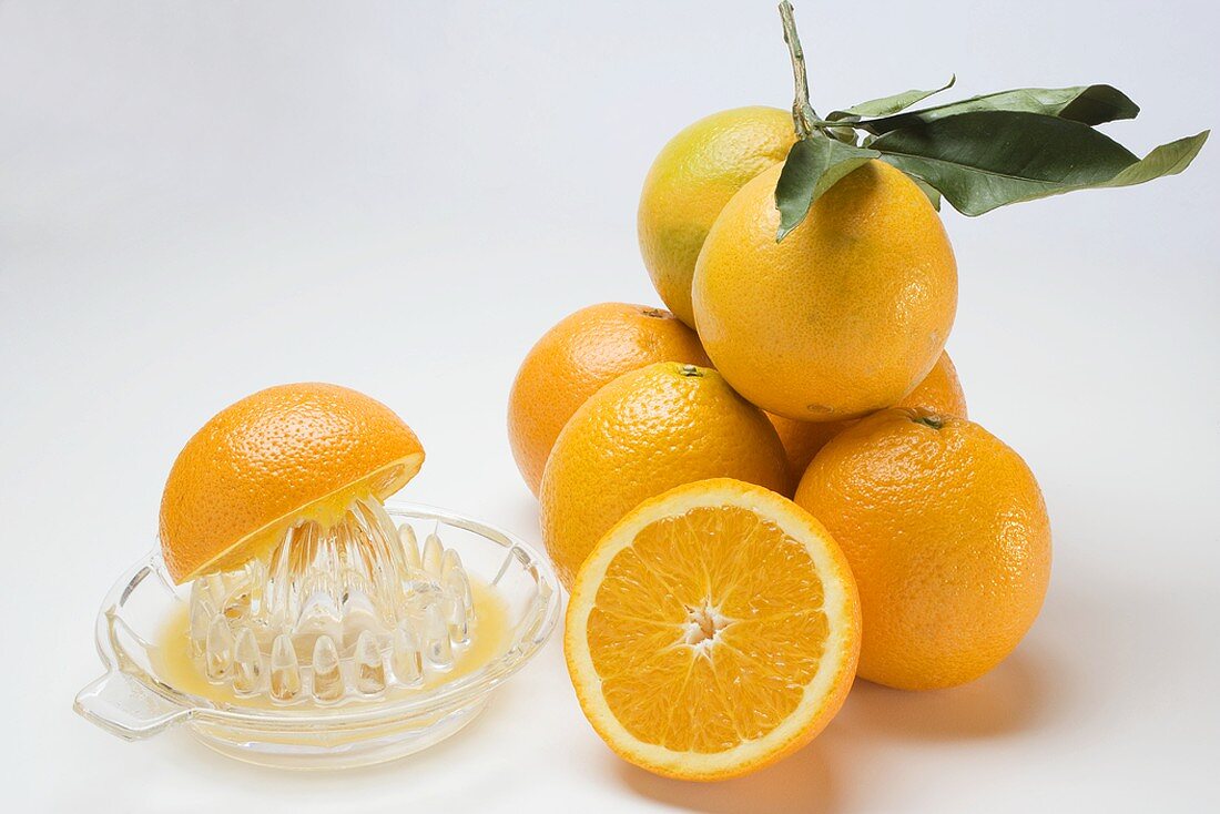 Juice oranges with citrus squeezer