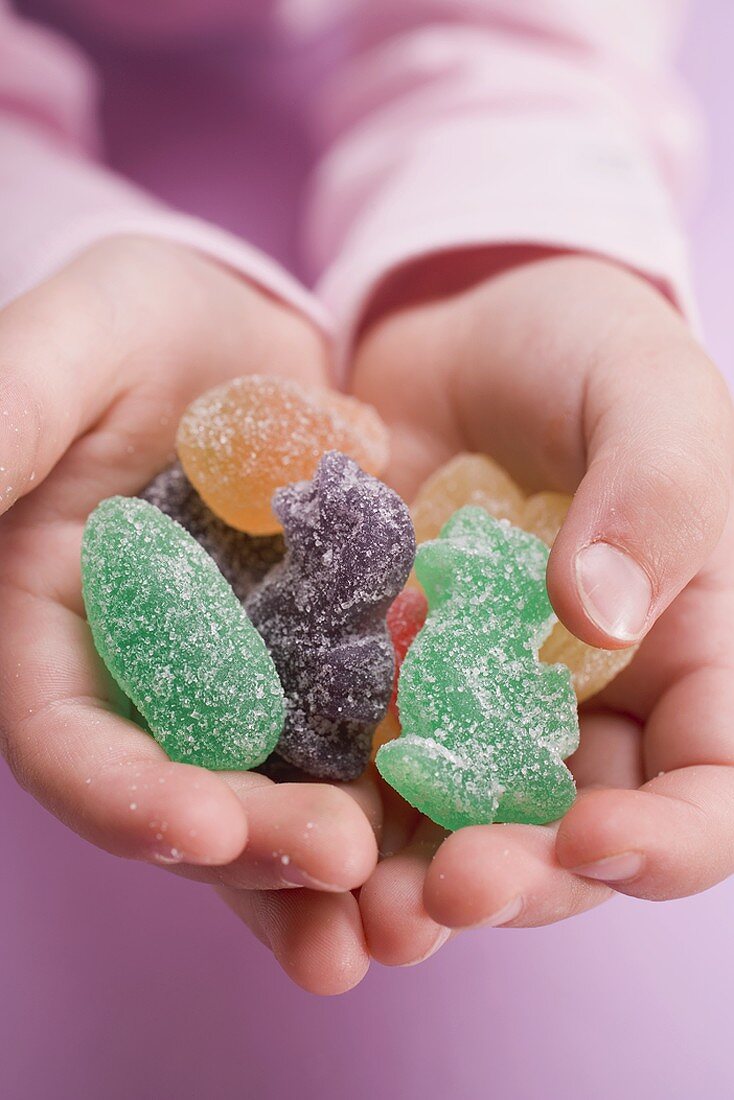 Child's hands holding jelly Easter sweets