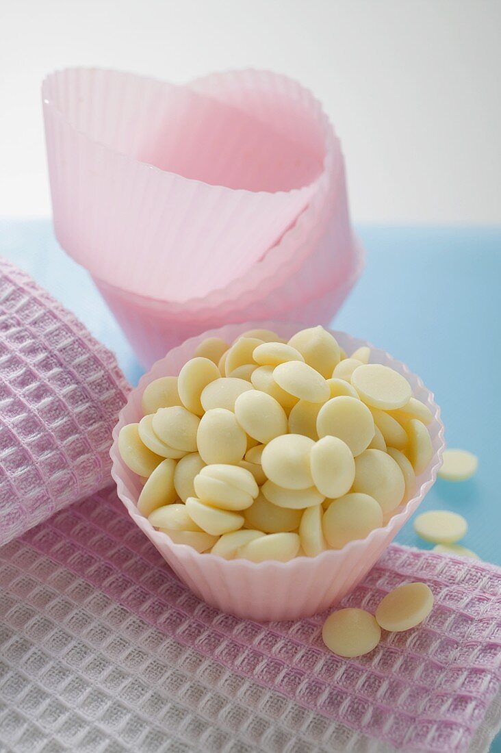 White chocolate chips in pink paper case