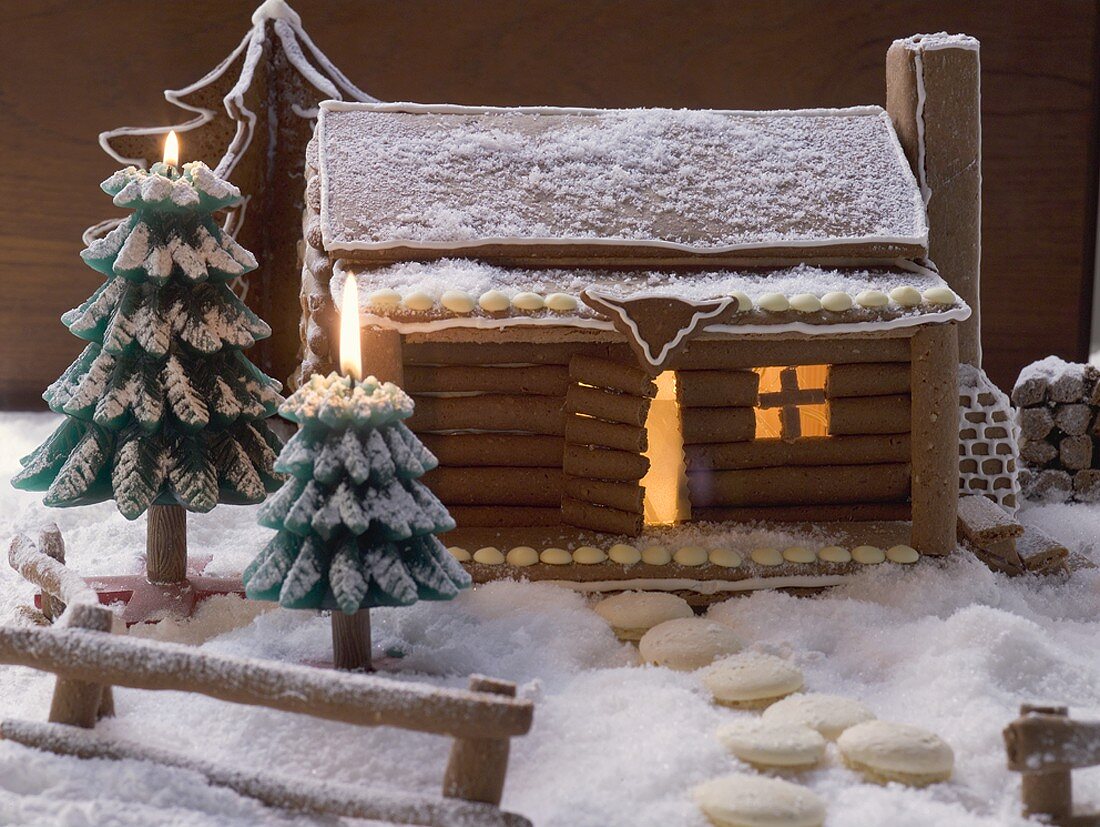 Gingerbread log cabin in snowy forest